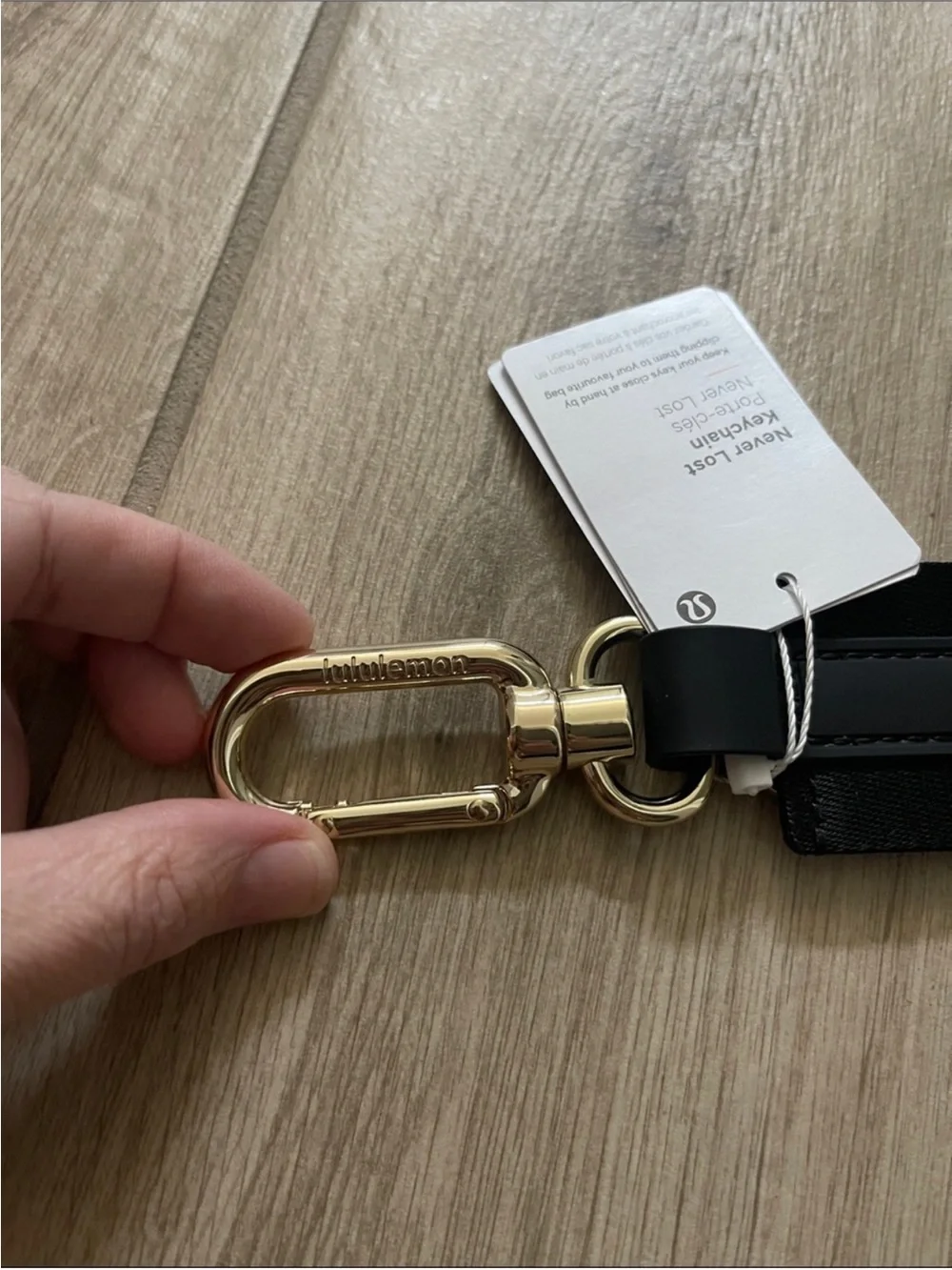 NWT Never Lost Keychain Black/ Gold Wordmark O/S